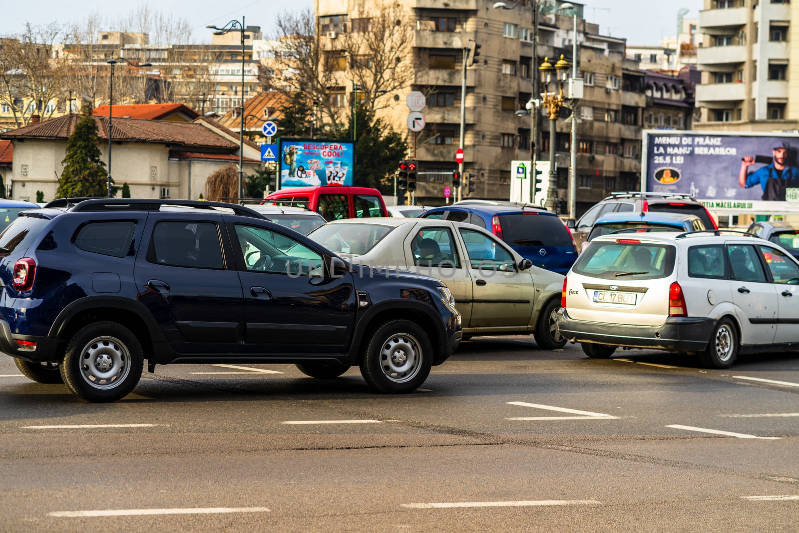 Car traffic at rush hour in downtown area of the city. Car pollution, traffic jam in the morning and evening in the capital city of Bucharest, Romania, 2020