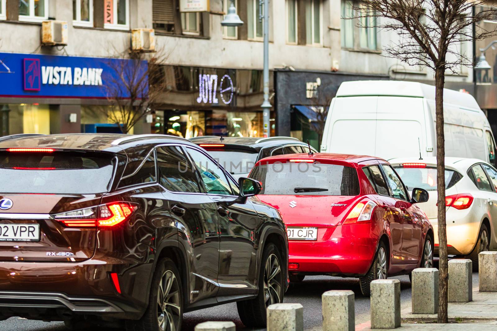 Car traffic at rush hour in downtown area of the city. Car pollution, traffic jam in the morning and evening in the capital city of Bucharest, Romania, 2020