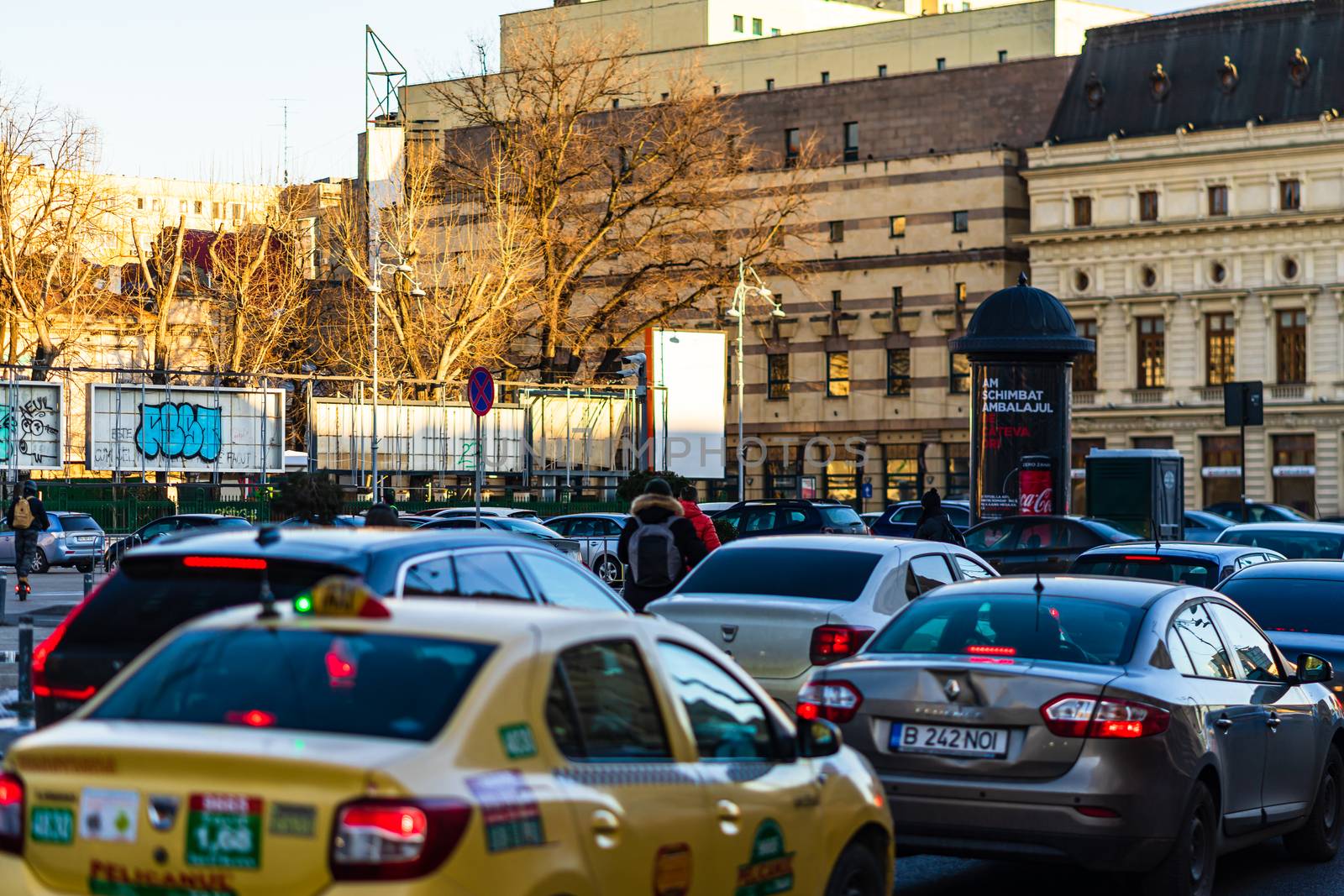 Car traffic at rush hour in downtown area of the city. Car pollu by vladispas