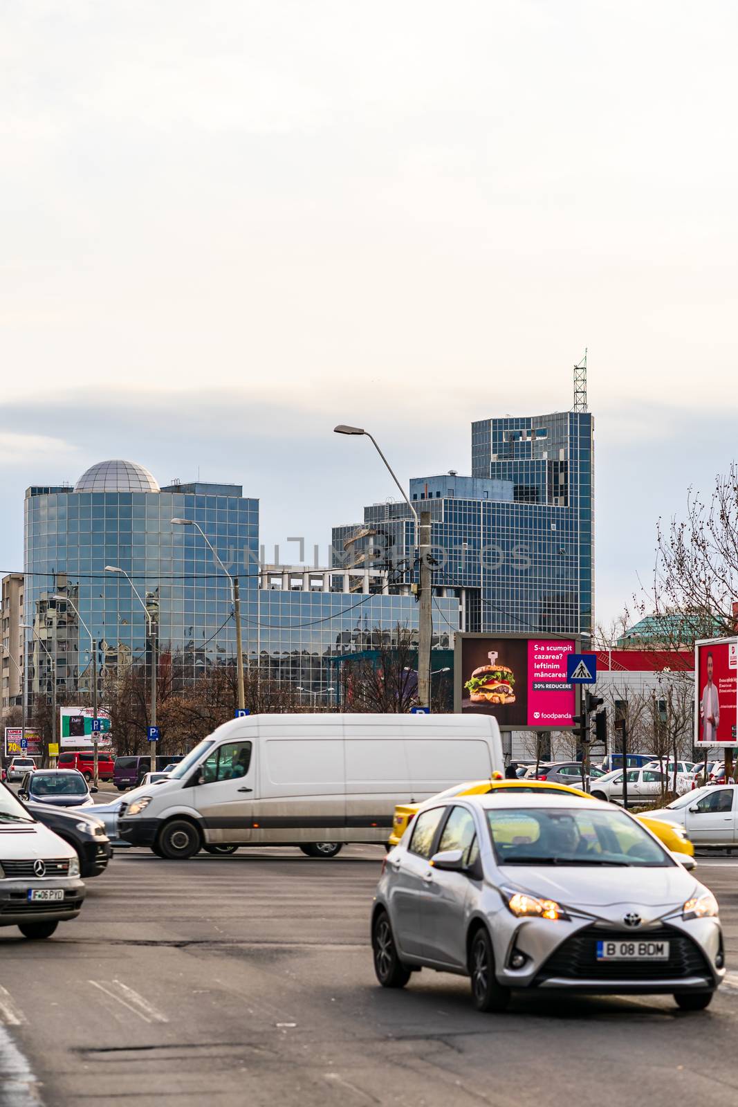 Car traffic at rush hour in downtown area of the city. Car pollu by vladispas