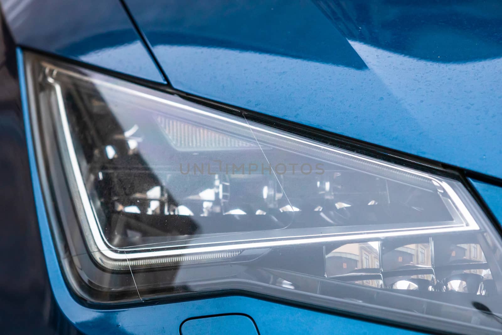 Close up photo of modern car, detail of headlight. Headlight car Projector LED of a modern luxury technology and auto detail.