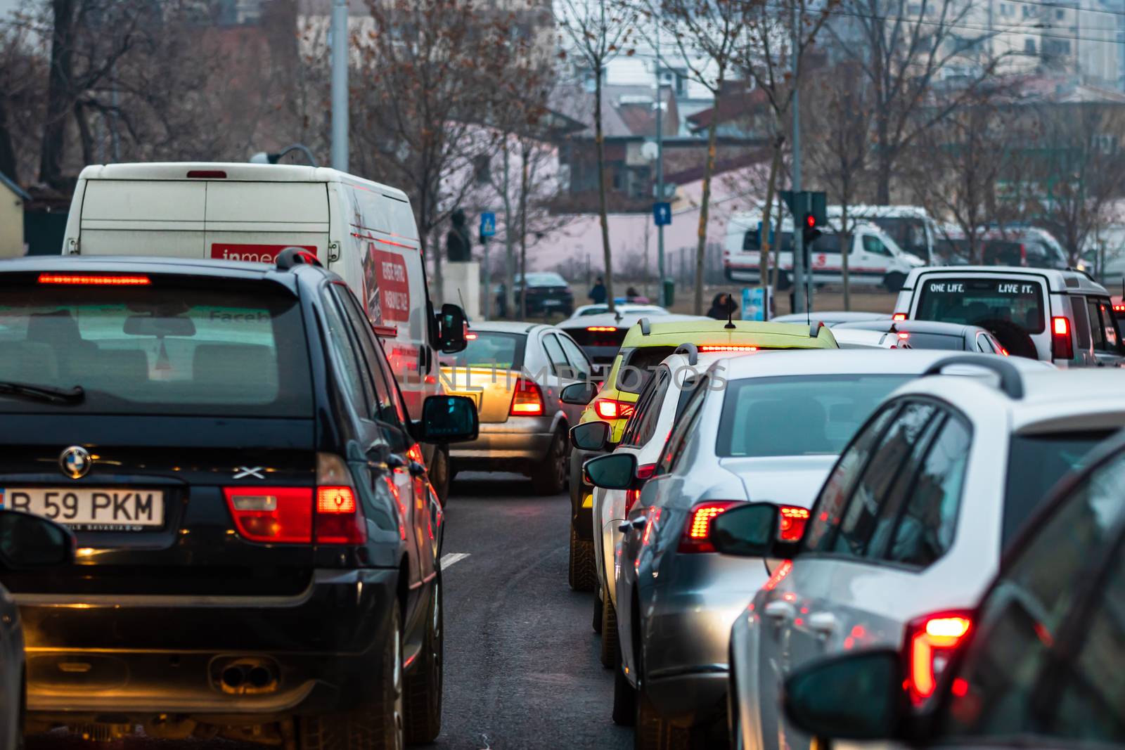 Traffic at rush hour in downtown Bucharest. Junction with stopped cars waiting for green light in Bucharest, Romania, 2020