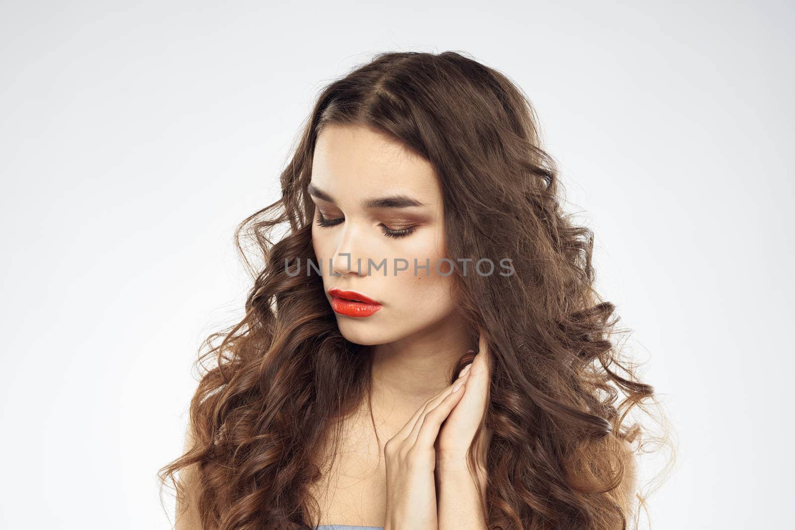 Elegant woman with bare shoulders red lips glamor attractive look cropped look. High quality photo