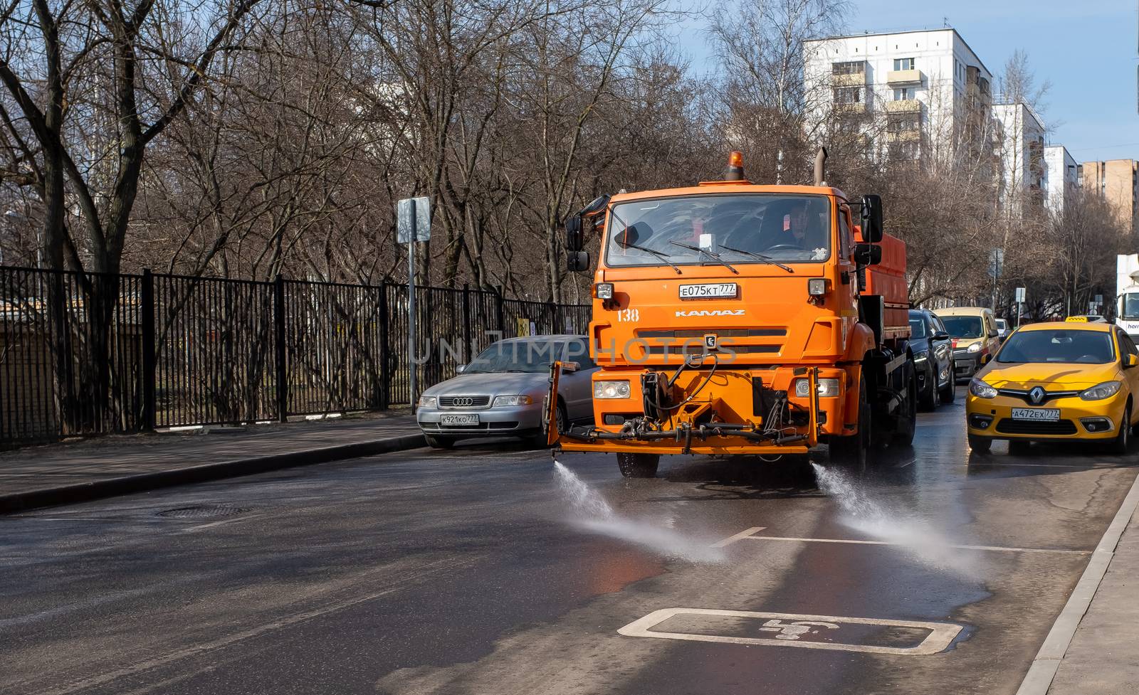 March 28, 2020, Moscow, Russia. Municipal equipment performs sanitary treatment of the street.