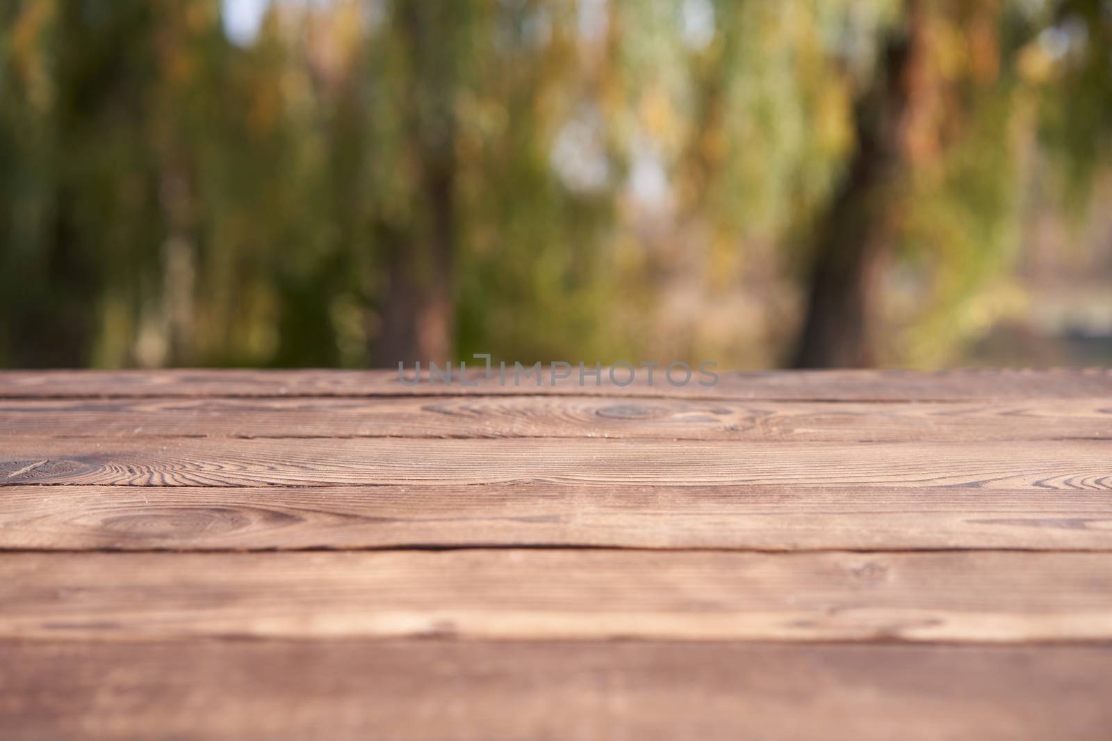 Empty wooden table nature bokeh background with a country outdoor theme,Template mock up for display of product Copy space