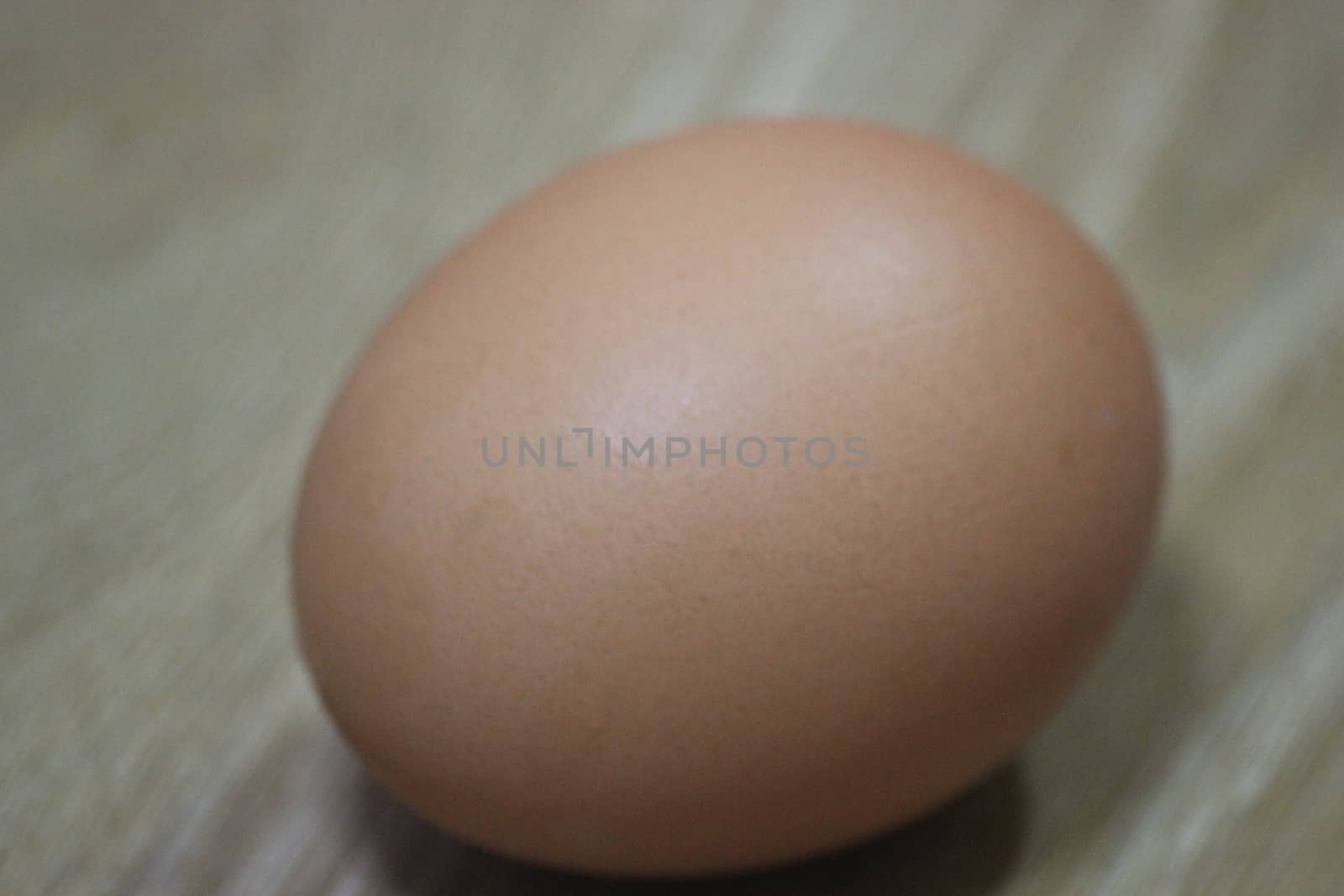 Closeup selective view of fresh farm chicken eggs isolated on a wooden background