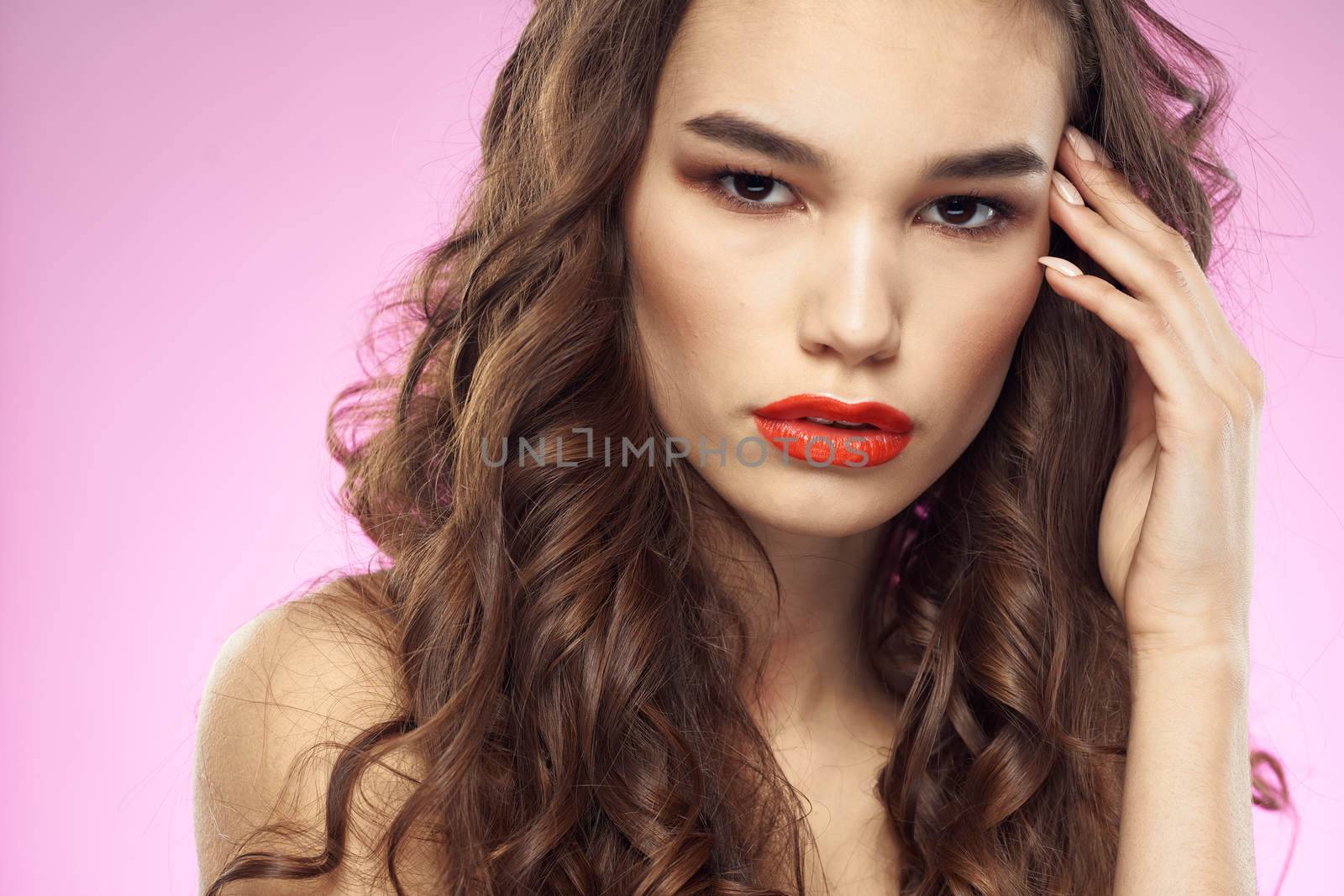 woman bright makeup red lips naked shoulders purple background. High quality photo