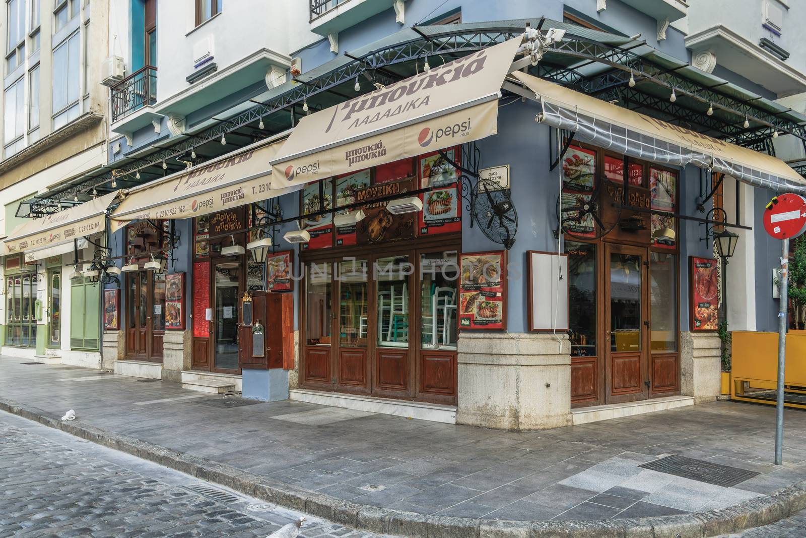 Day view of closed restaurant at Ladadika area, due to lockdown covid-19 measures.