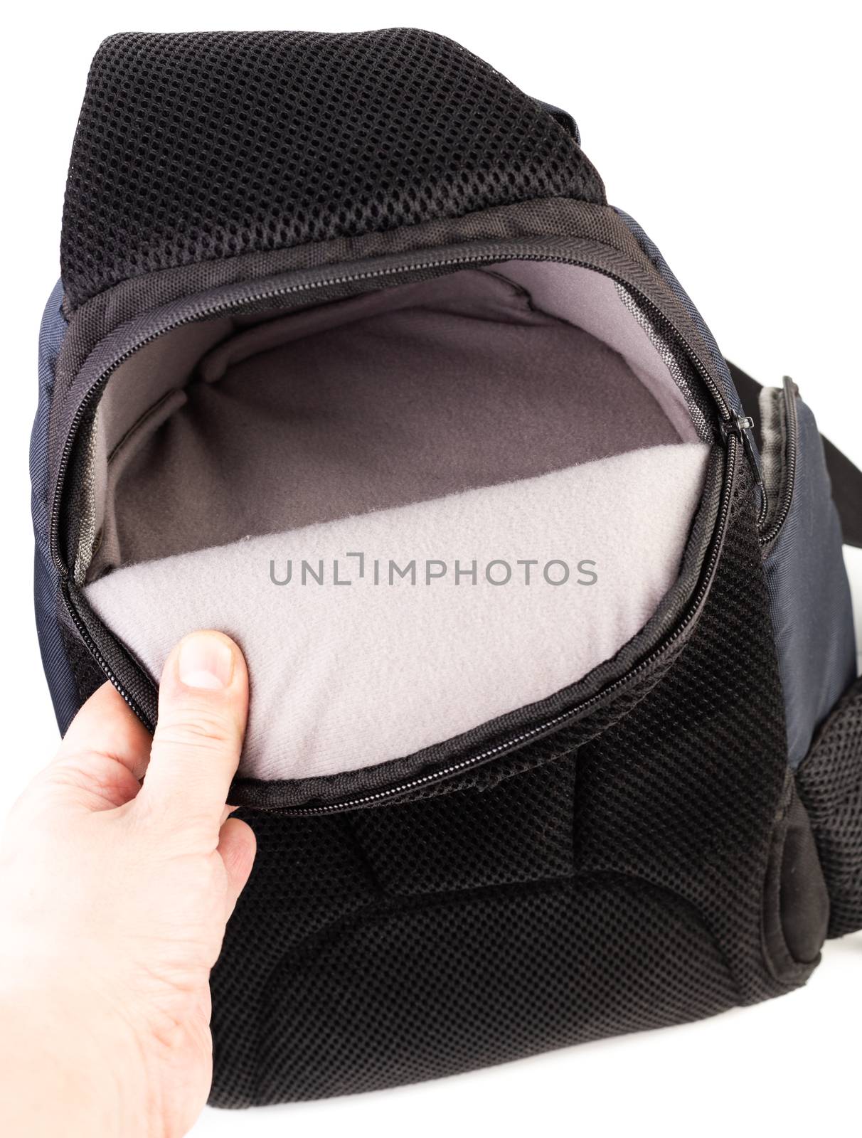 Used black and blue fabric camera bag isolated on white background.