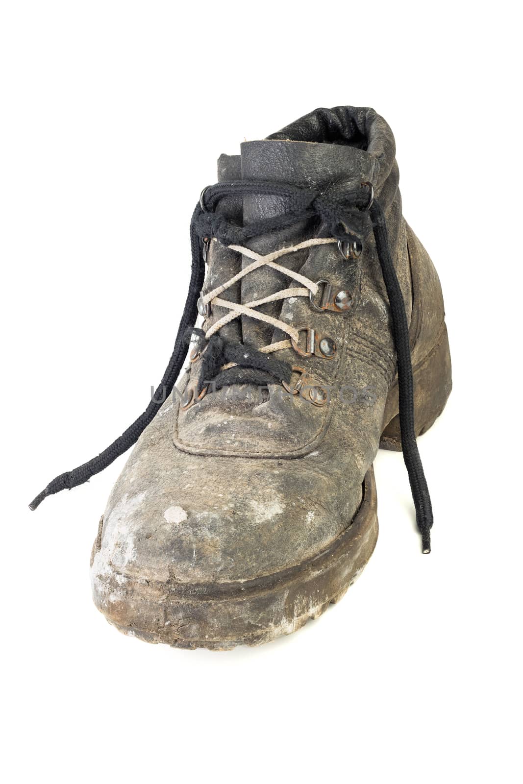 Right one dirty worn-out old work boot, isolated on white background with shadow.