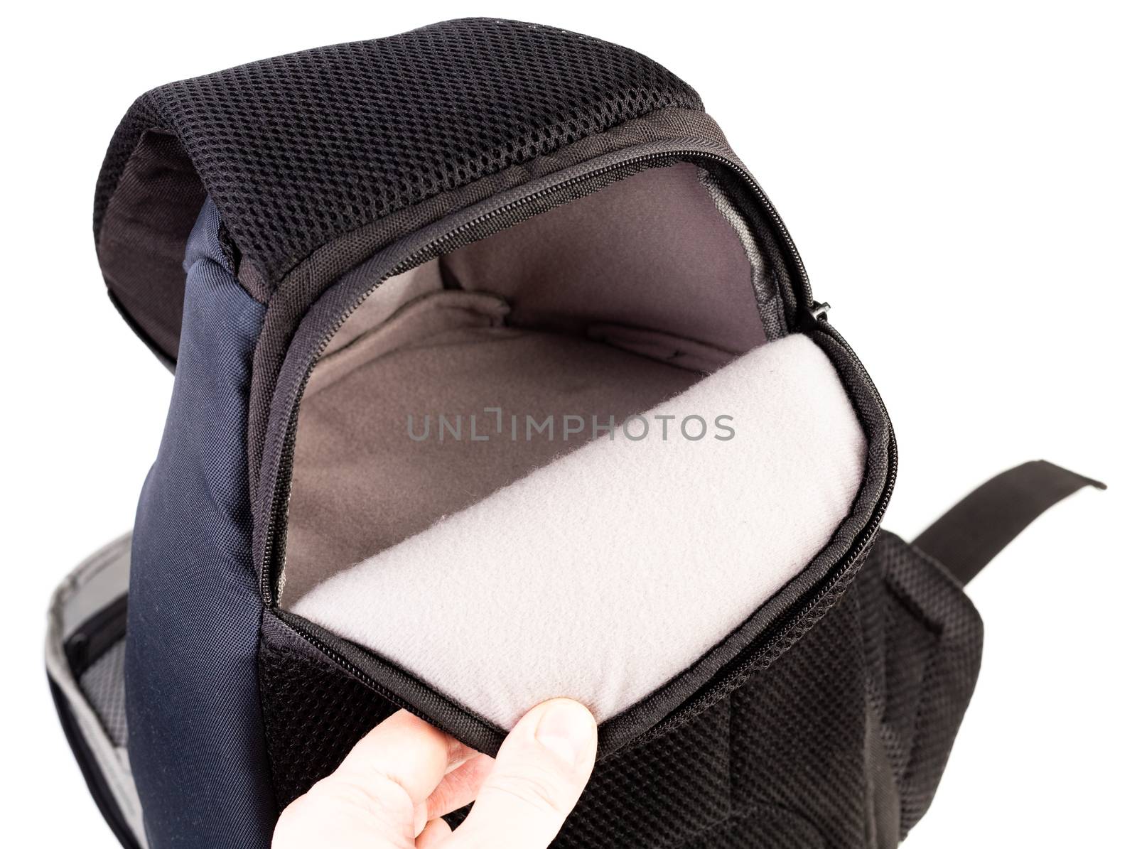 Used black and blue fabric camera bag isolated on white background.