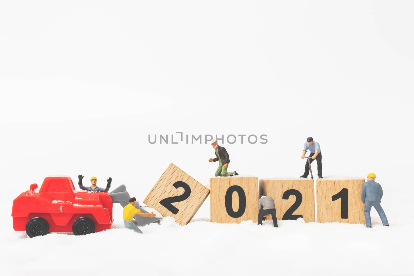 Miniature people : Worker team create wooden block number 2021  by sirichaiyaymicro