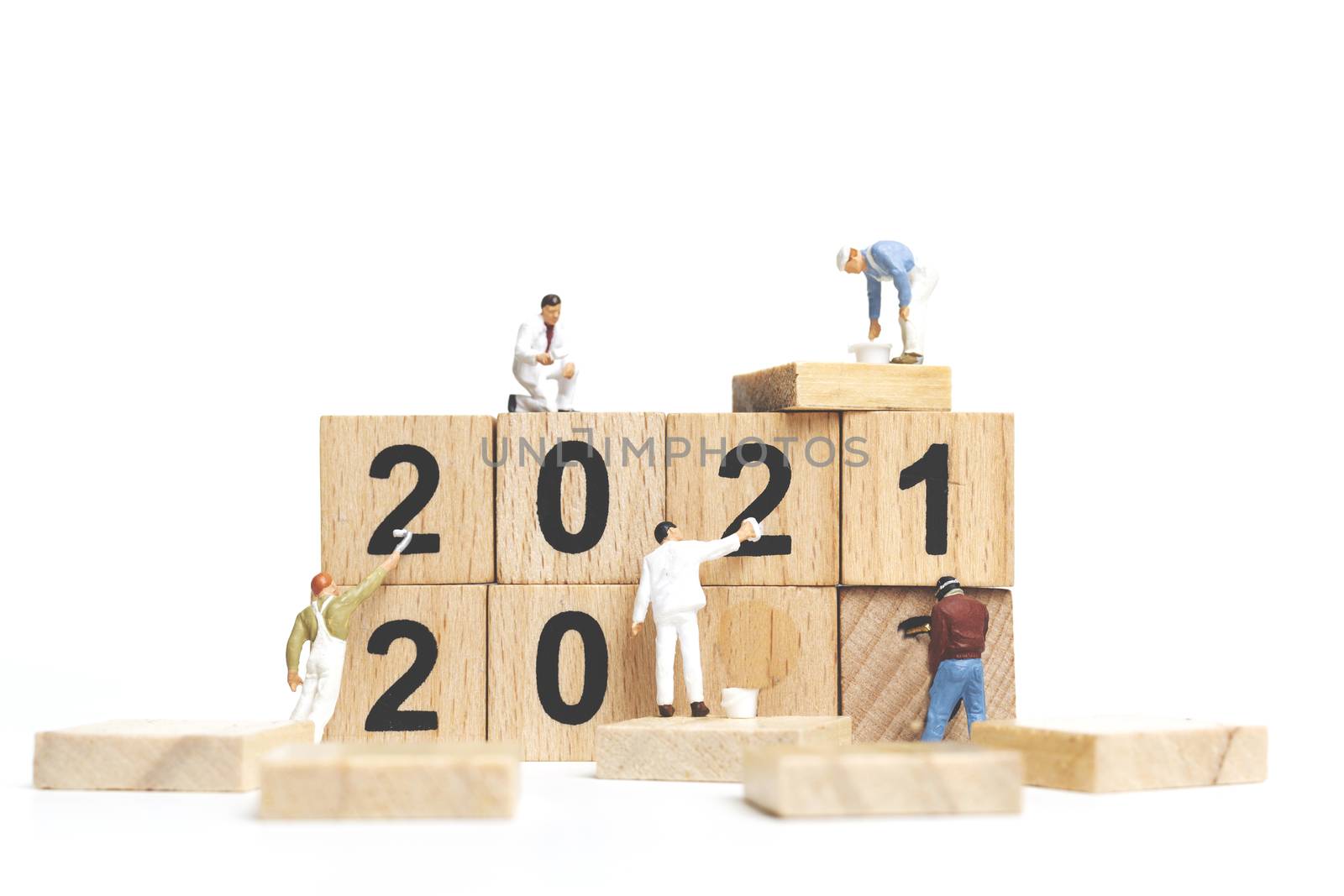 Miniature worker team painting number 2021 on white background , Happy new year concept