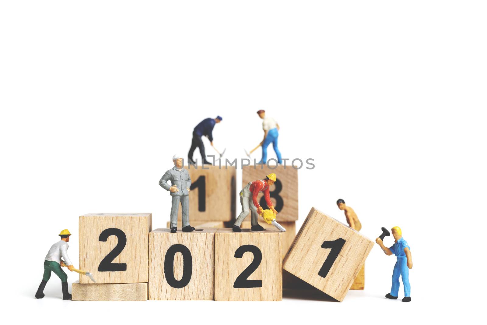 Miniature worker team painting number 2021 on white background , Happy new year concept