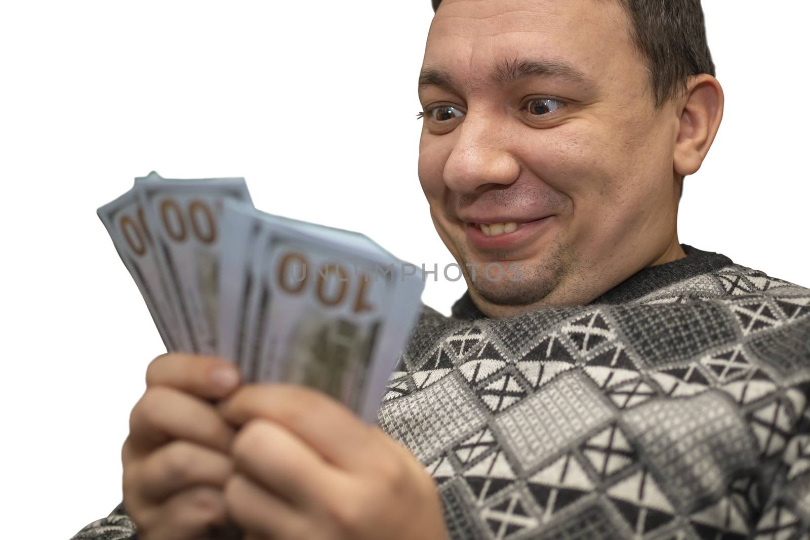 the happy, contented, abnormal, crazy face of a man who holds money and looks at it with a smile and pleasure