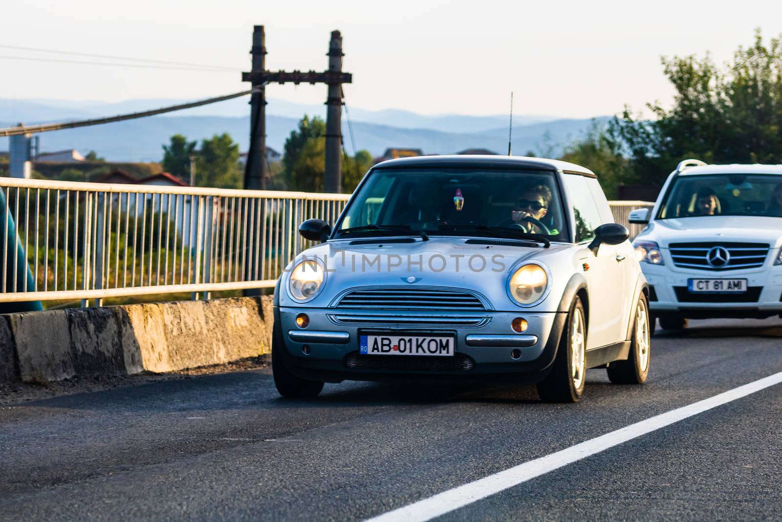 Traveling car in motion on asphalt road, front view of car on street. Bucharest, Romania, 2020