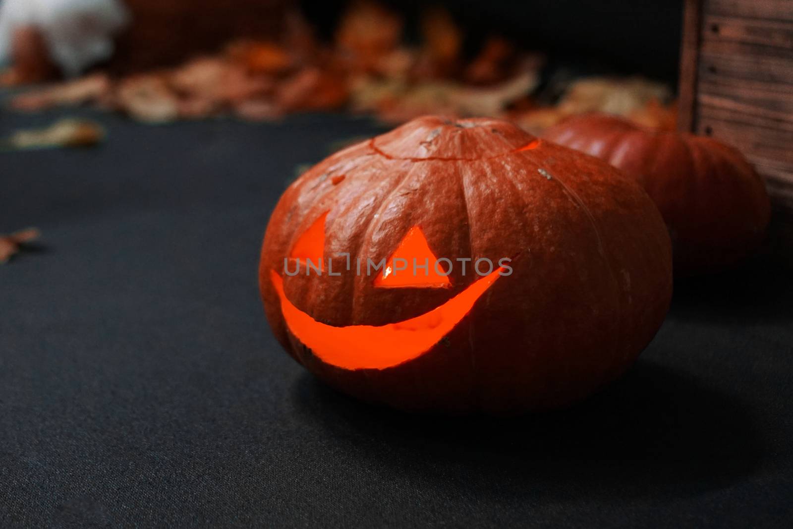 Halloween Pumpkin in front of spooky dark background. by natali_brill