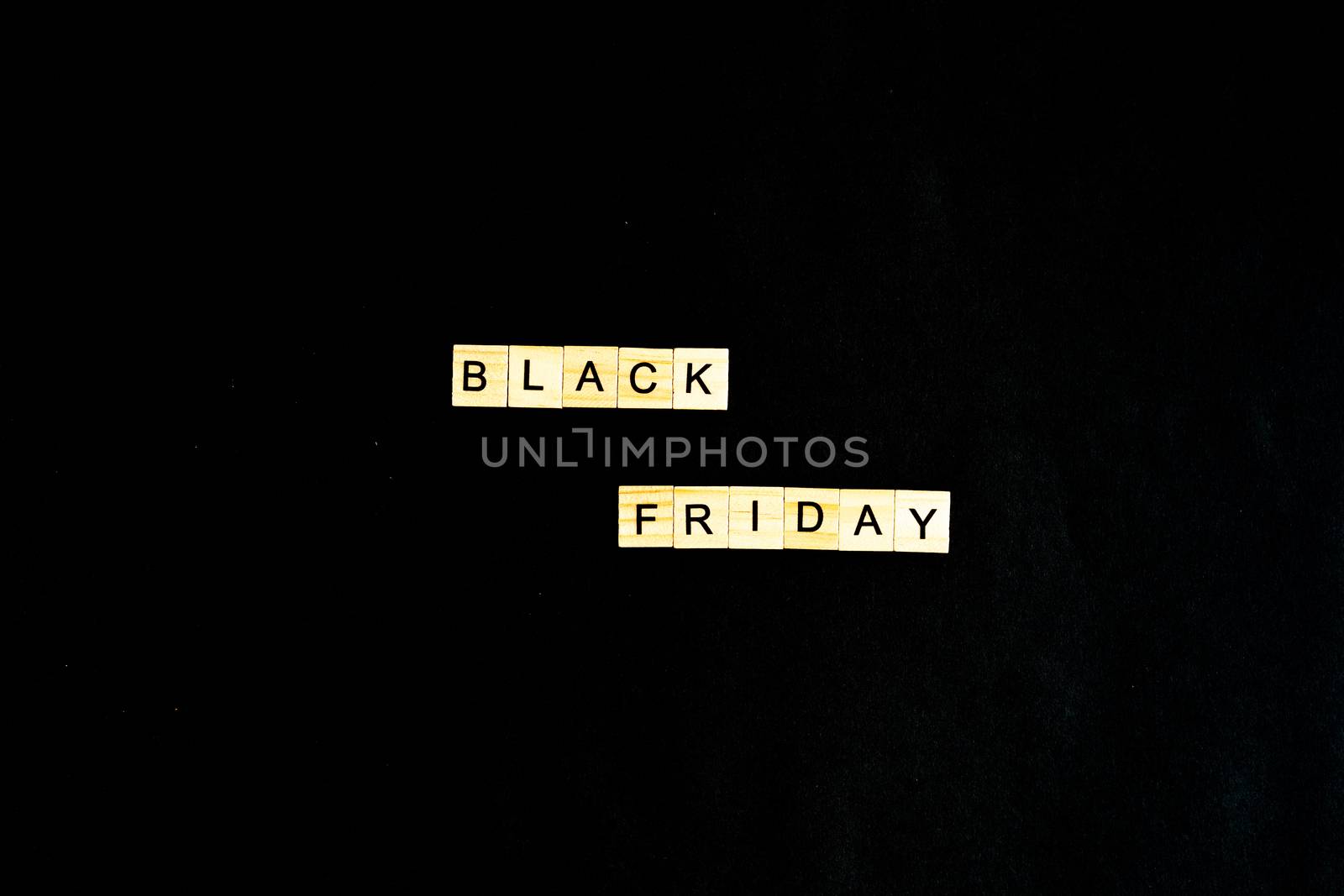 Black Friday written in wooden letters on a black background, sales, holiday sales, top view, flat layout, price reduction by Pirlik