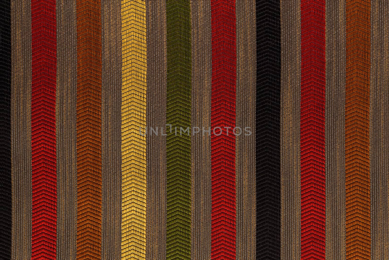 Vertically striped flat polyester upholstery dark colored texture and background