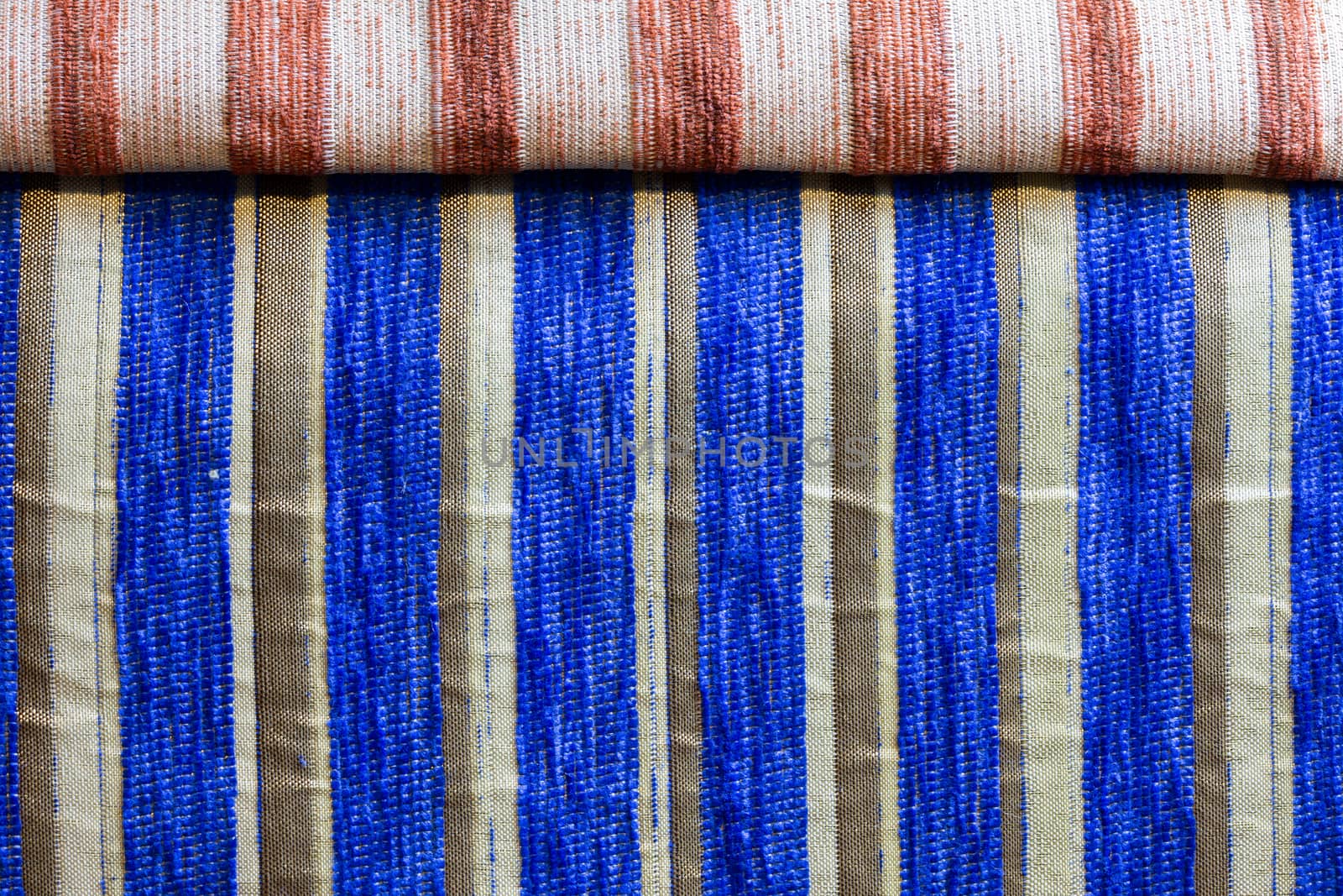 blue striped synthetic woven upholstery fabric close-up texture and background