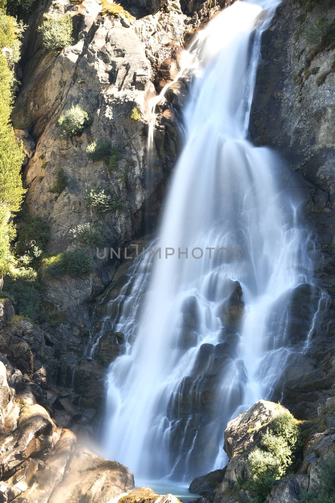 The Rutor waterfall, in Valle d'Aosta, descends impetuously among the rocks