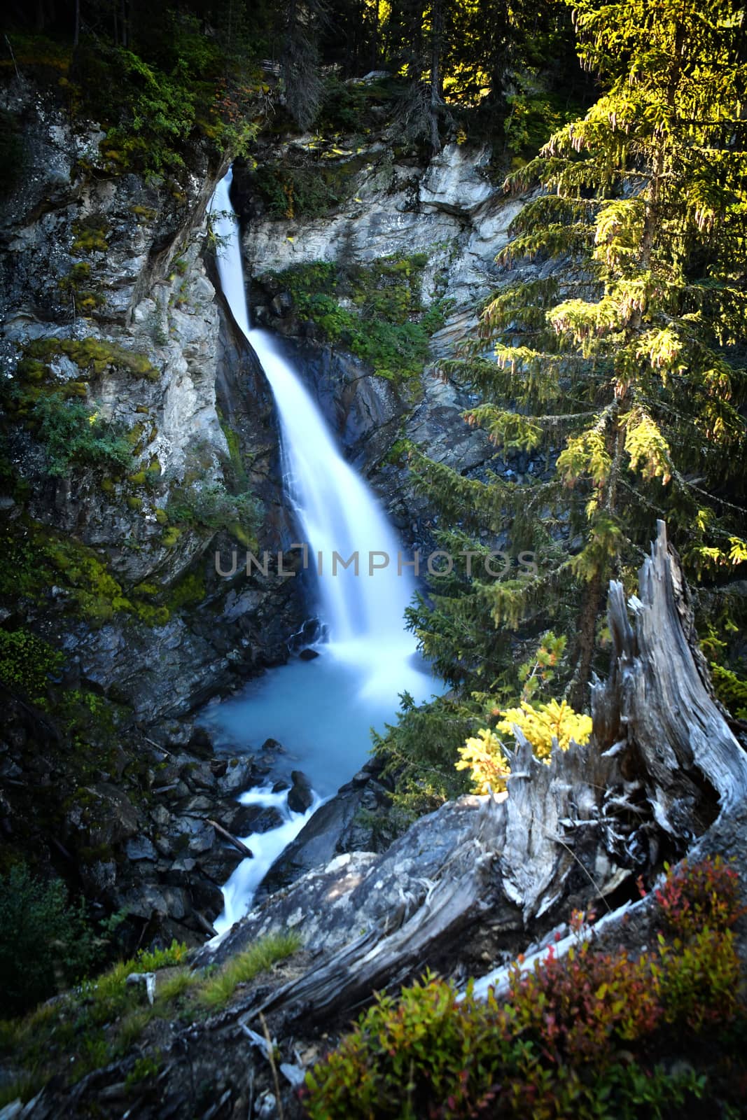 The Rutor waterfall, in Valle d'Aosta, descends impetuously among the rocks