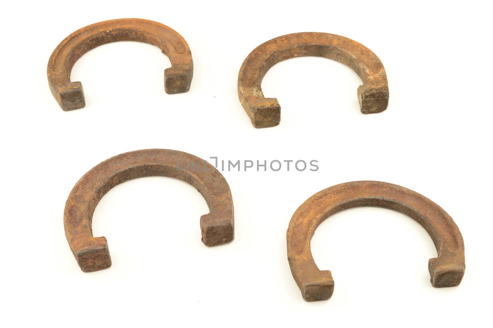 Four horse shoes isolated over white.