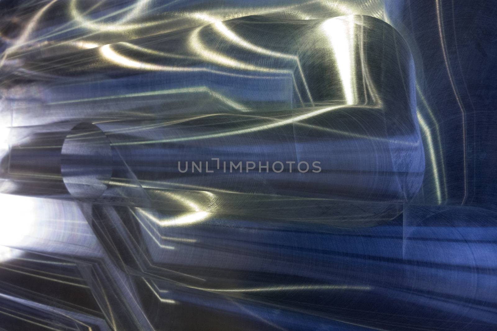 Large metal surface after end milling by large shell mill with specific concentric notches and light reflections. Selective focus closeup technique