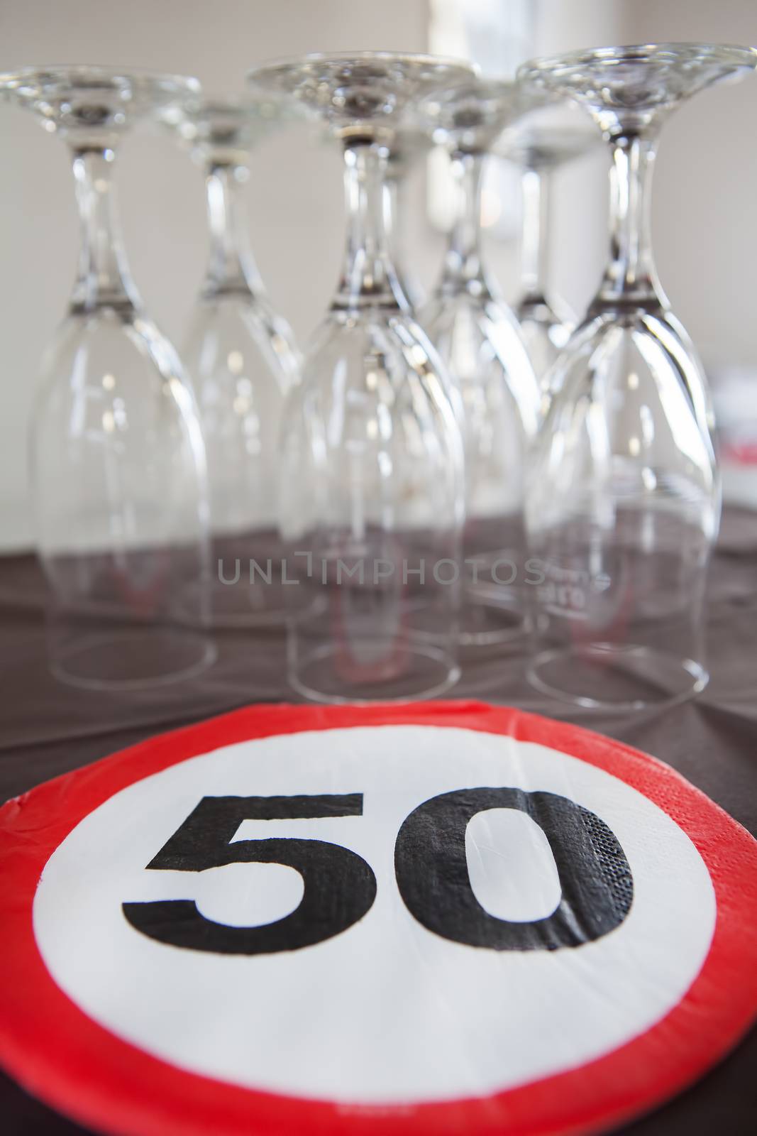 A 50th anniversary party with champagne glasses by Kasparart