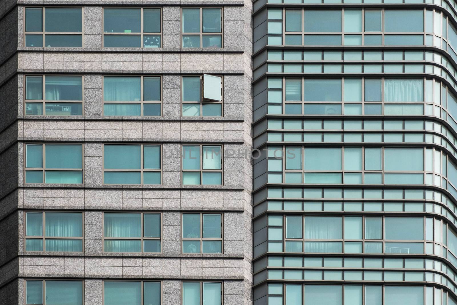 Glass windows of office building background by Surasak