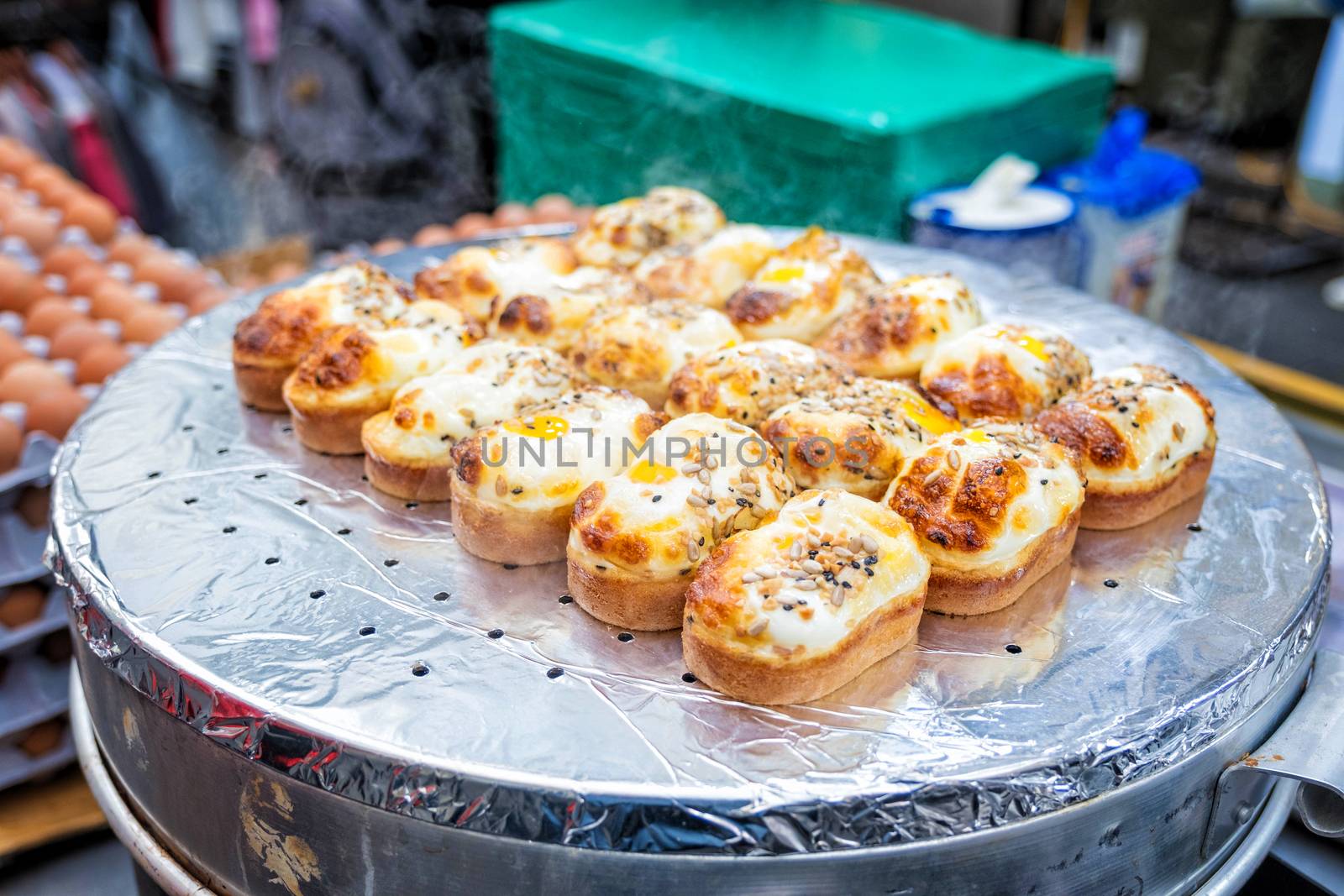 Egg bread with almond, peanut and sunflower seed at Myeong-dong street food, Seoul, South Korea 