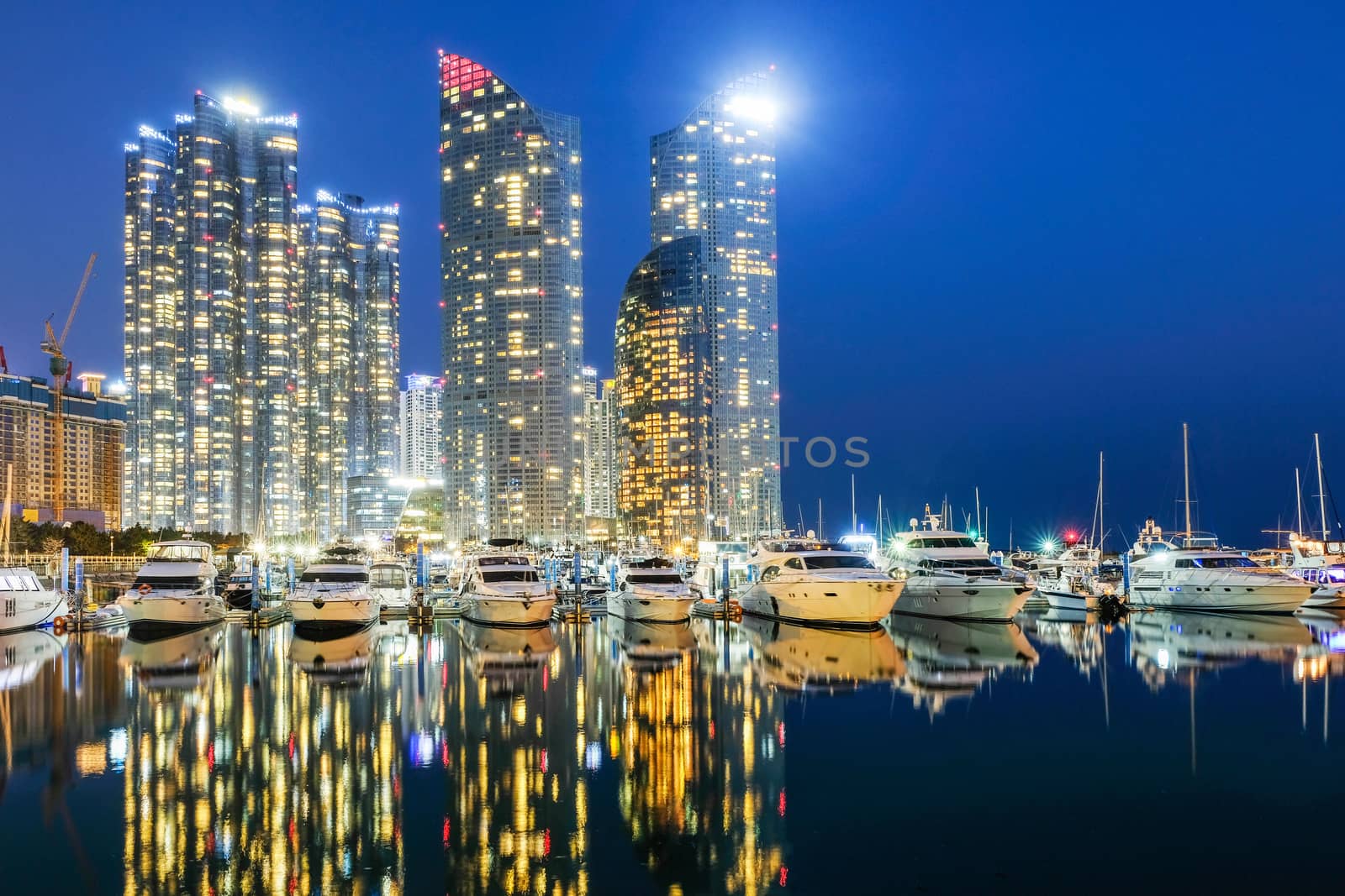 Night view of Skyscrapers Busan Marine City with reflection 