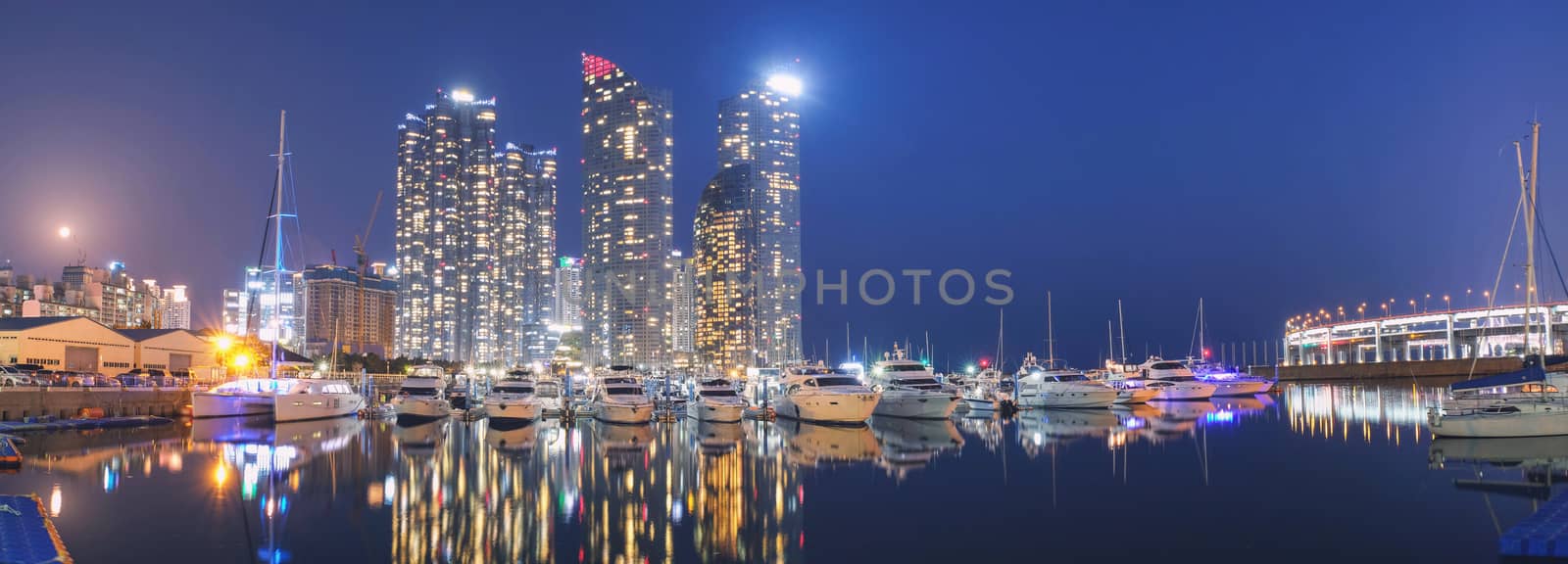 Panorama night view of Skyscrapers Busan Marine City with reflection 