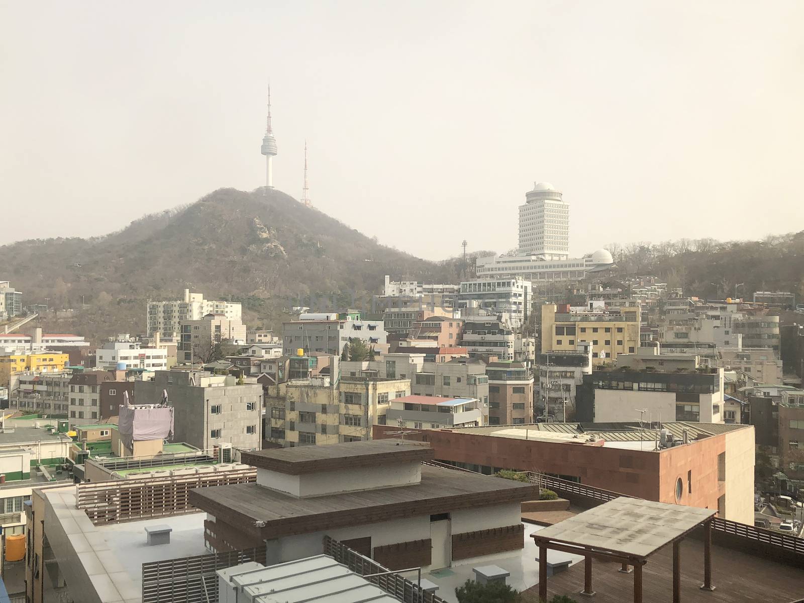 Cityscape rainy day view of Seoul and Namsan Seoul Tower, South  by Surasak