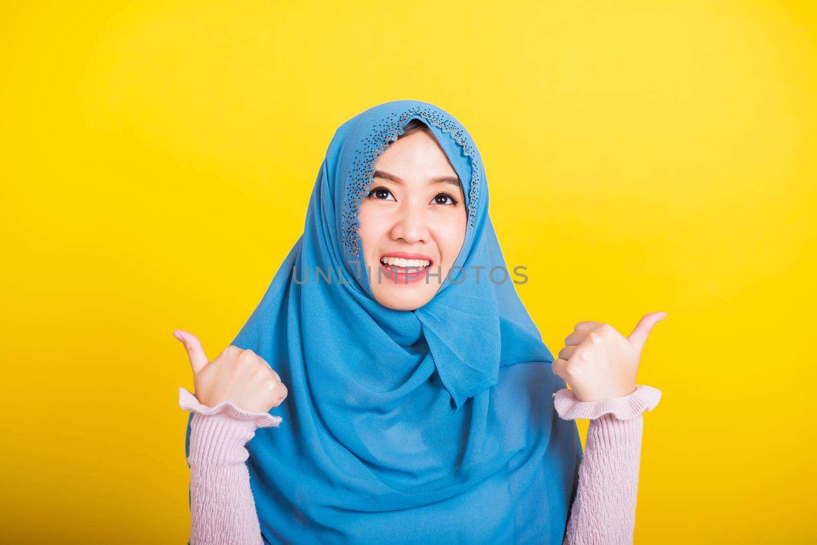 Asian Muslim Arab woman Islam wear hijab she made finger thumbs  by Sorapop