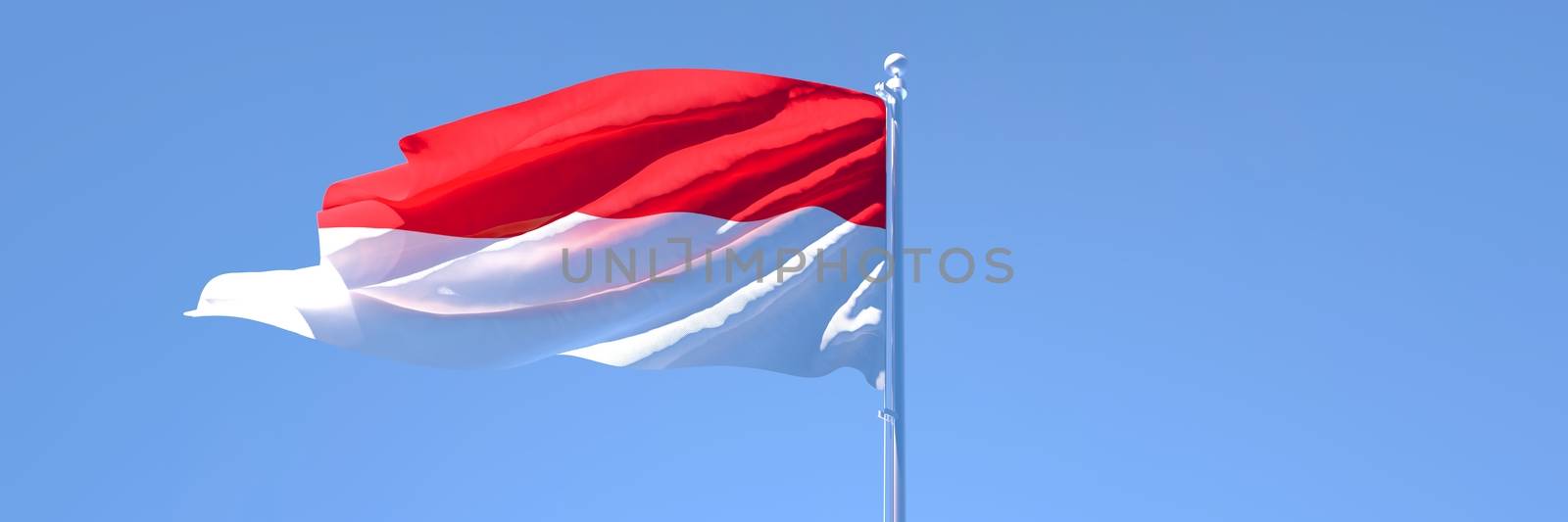 3D rendering of the national flag of Indonesia waving in the wind against a blue sky