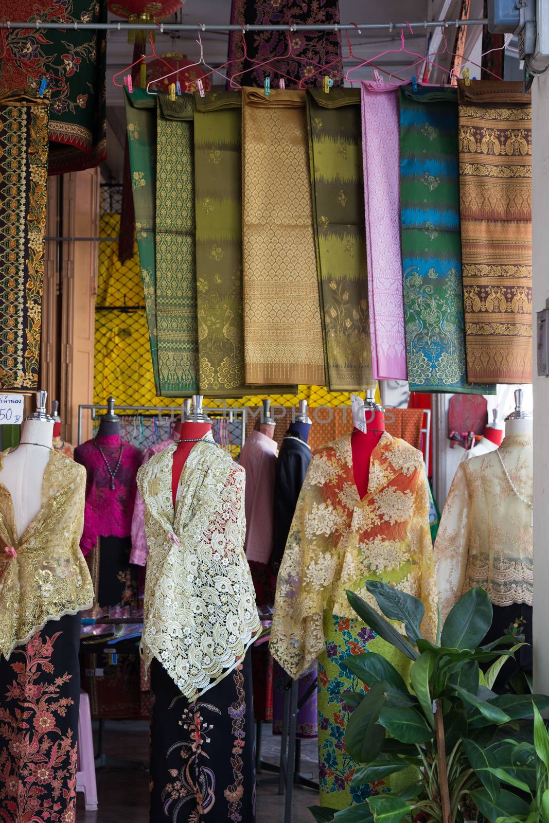 Fabrics stall Pha Soet Hot Spring Chiang Rai Thailand with clothes and material. High quality photo