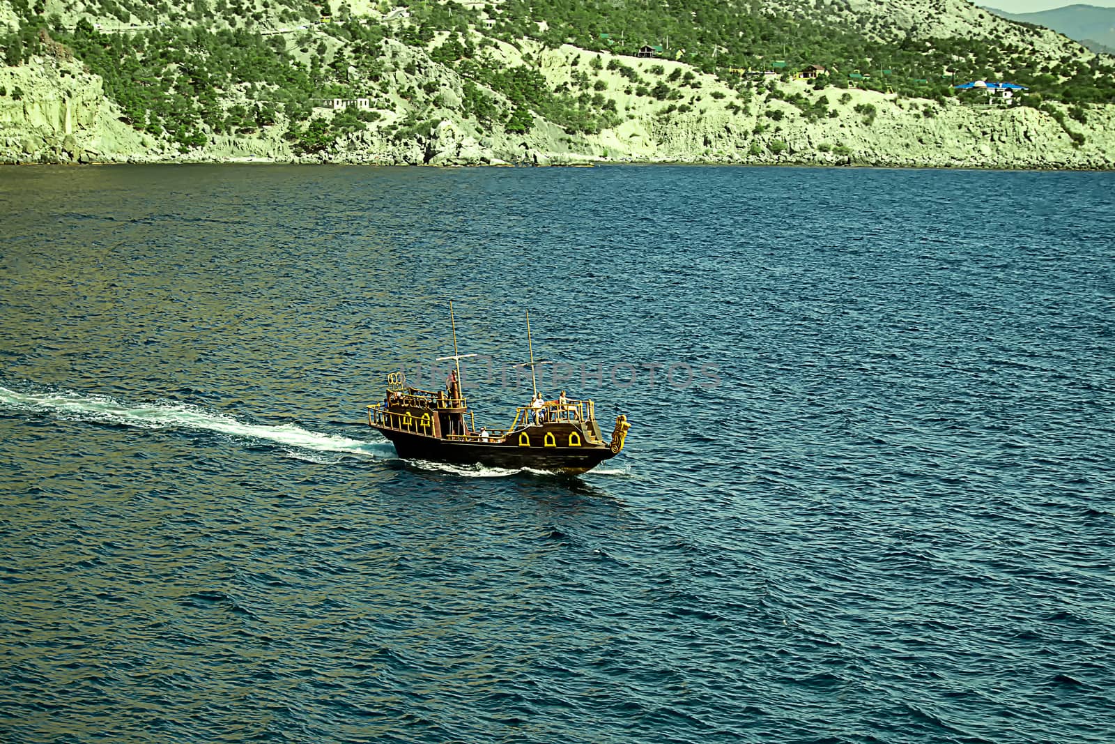 Boat in the form of galleys on black sea