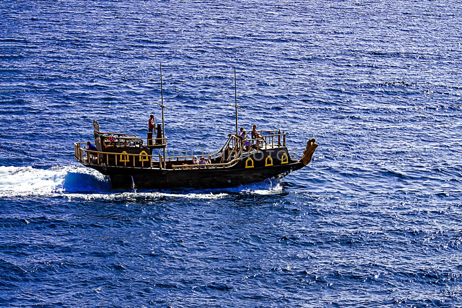 Boat in the form of galleys on black sea