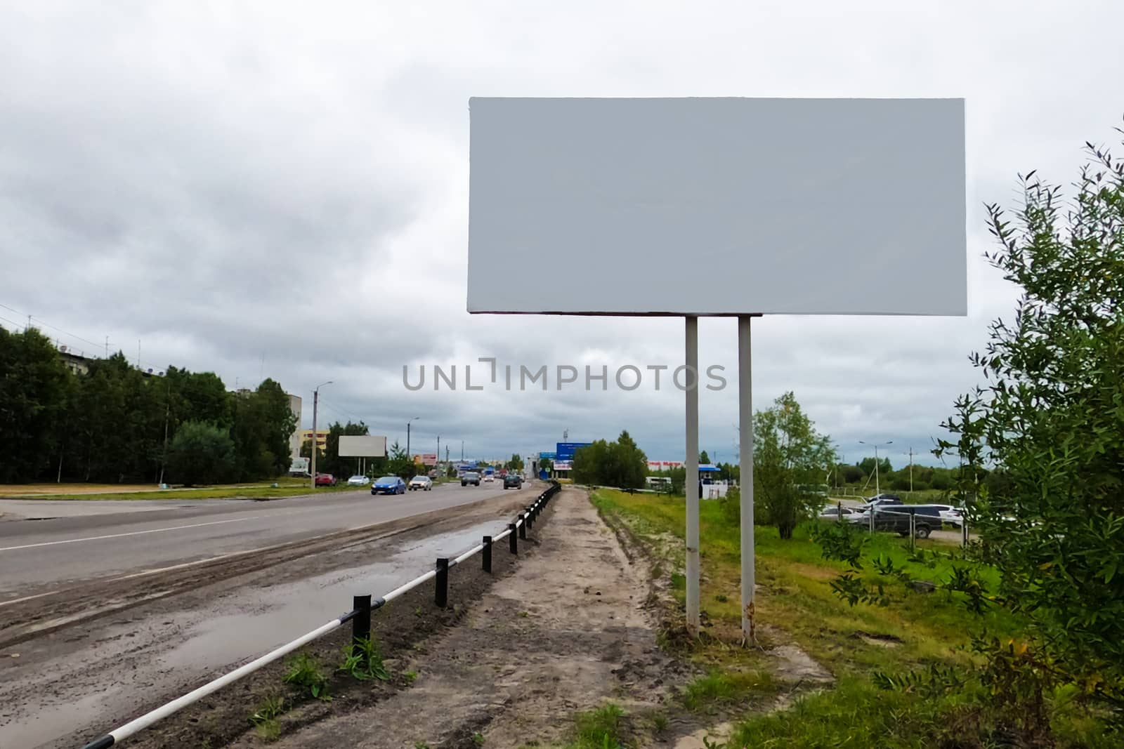 Billboard. Copy space. Urban traffic. Street of the northern city in Siberia. by Essffes