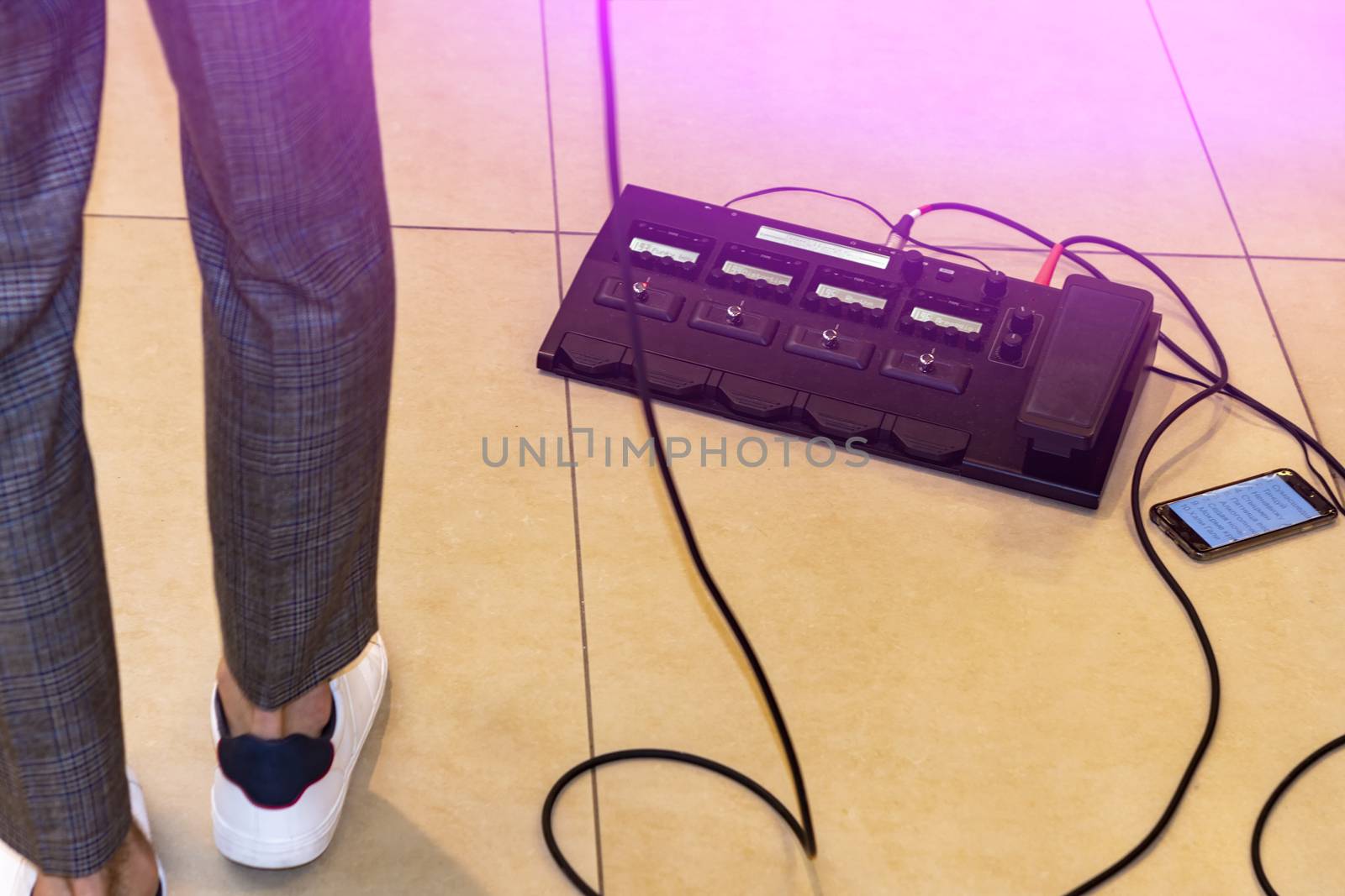 On the floor. There's a guitarist nearby. We've had his legs in sneakers and wires.