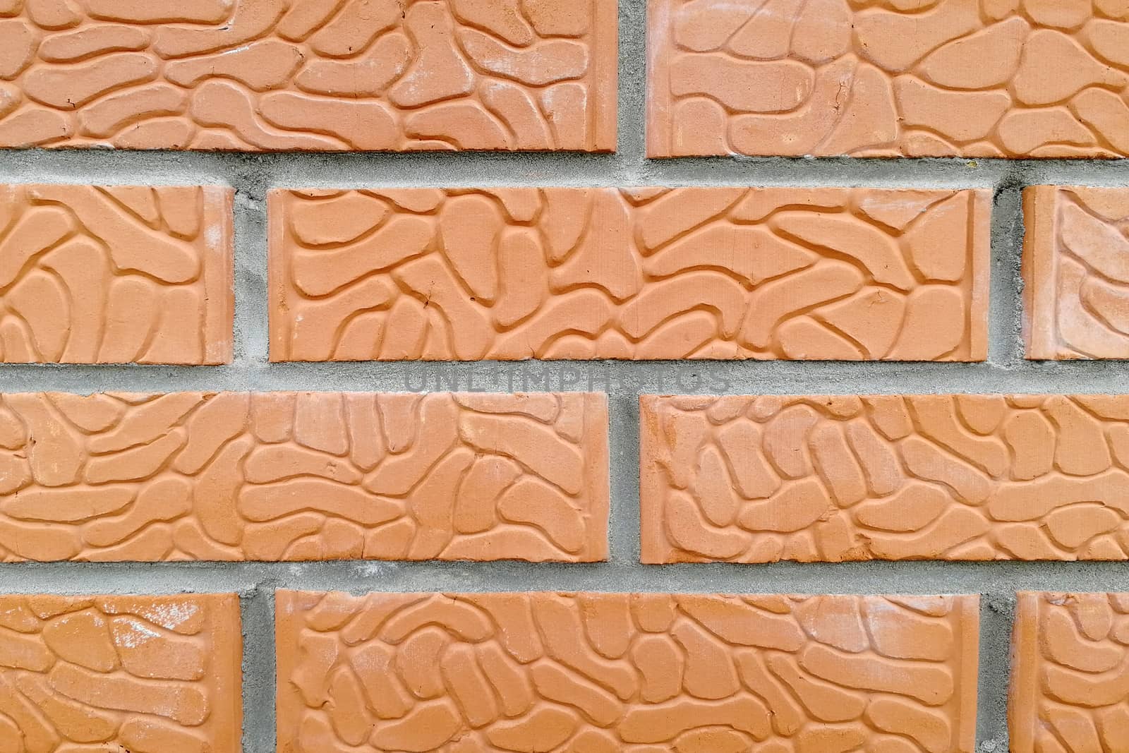 Orange and textured stone. Front view
