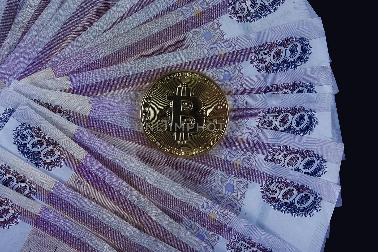Russian paper money and bitcoin.