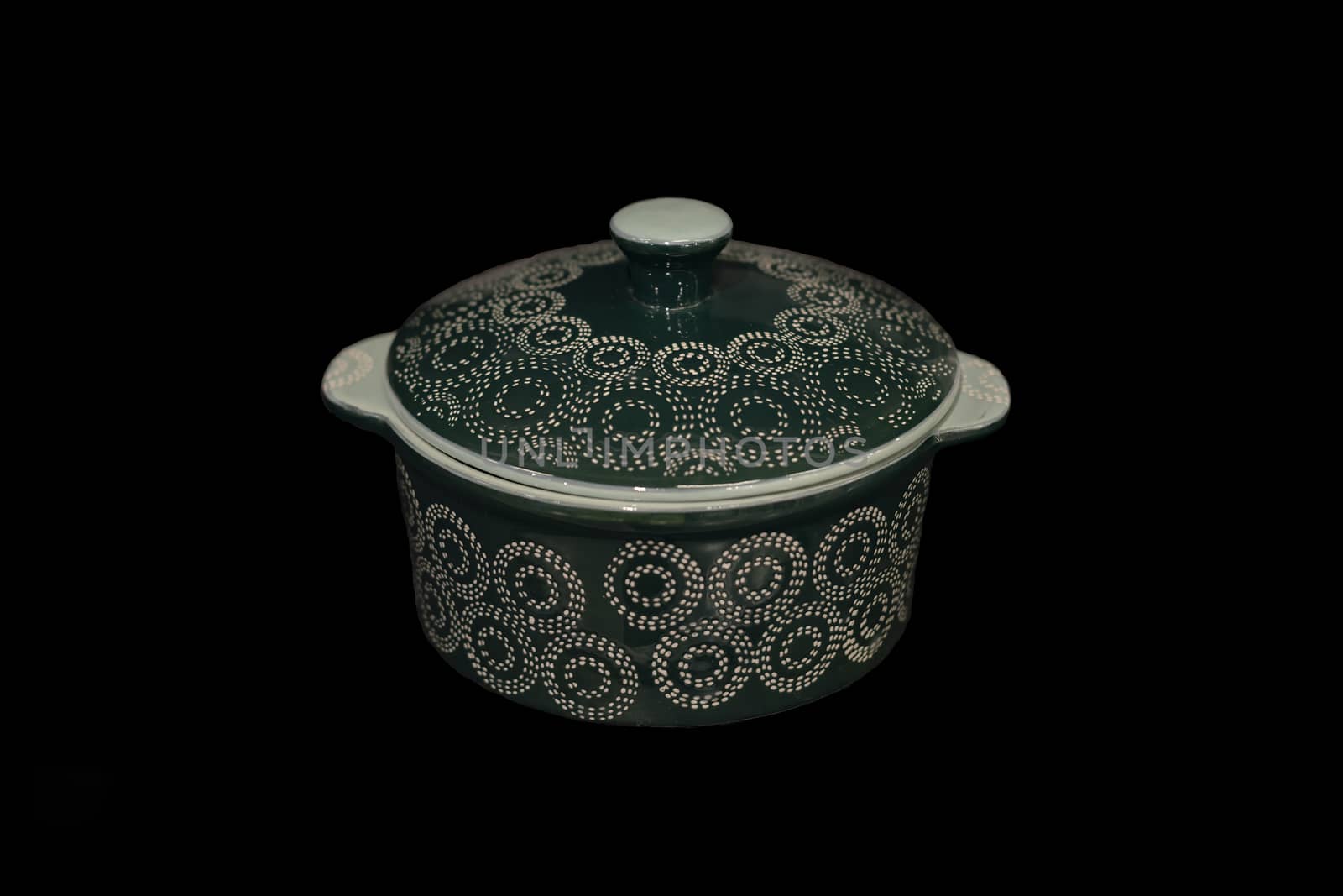 Ceramic pan on a black background.