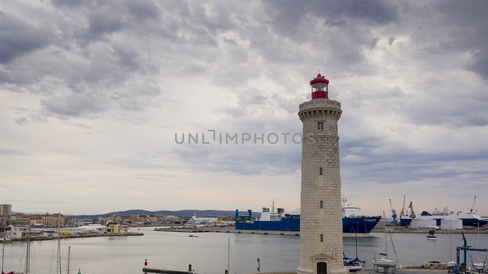 The commercial port from the lighthouse on the mole Saint Louis de Sète, in Herault, in Occitanie, France by Frederic