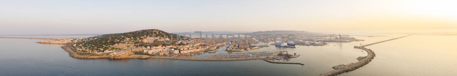 Aerial panorama of the city of Sète and the port, during sunrise, in the Hérault department in Occitanie, France by Frederic