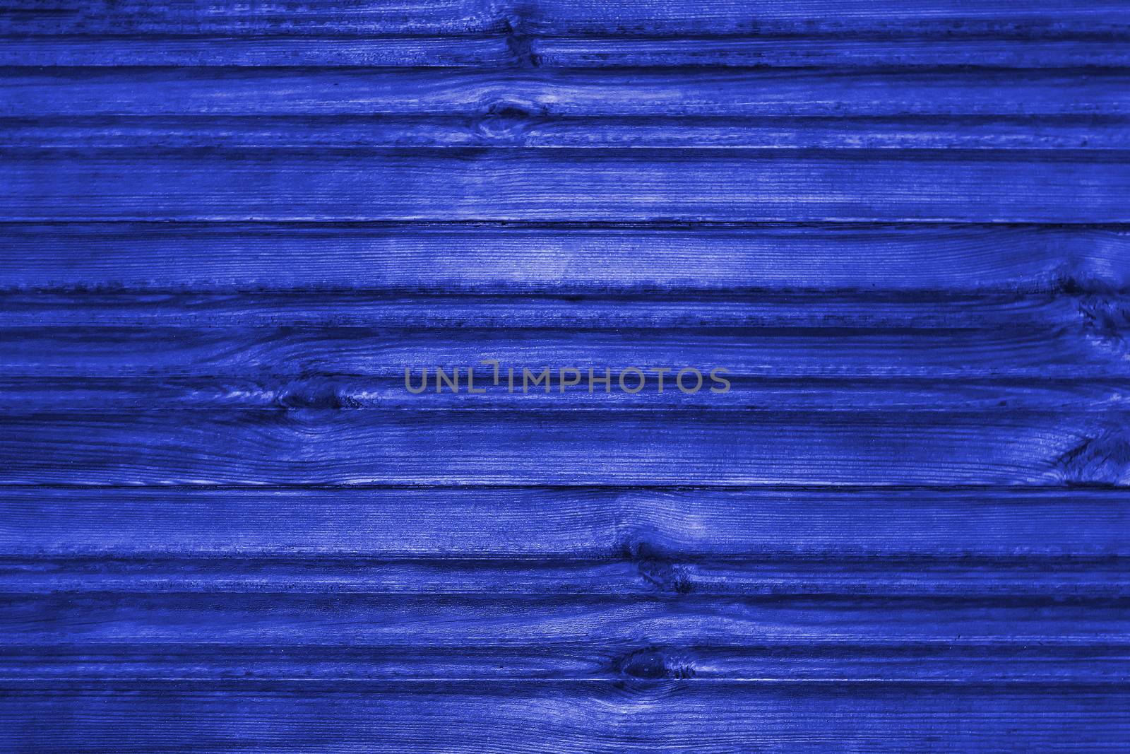 Blue wooden textured background. View from the front. Pantone 2020.