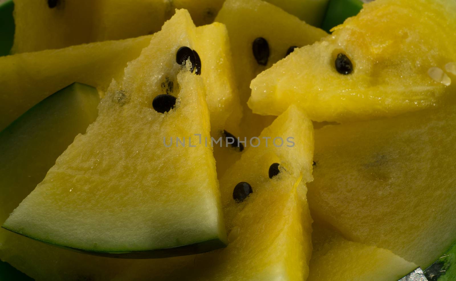 Yellow watermelon with slices and wedges for effective watermelon diet