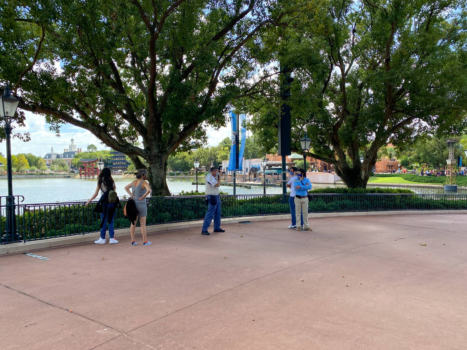 Orlando,FL/USA-10/24/20: Two men getting their photo taken in  he World Showcase in EPCOT at Disney World in Orlando, Florida.