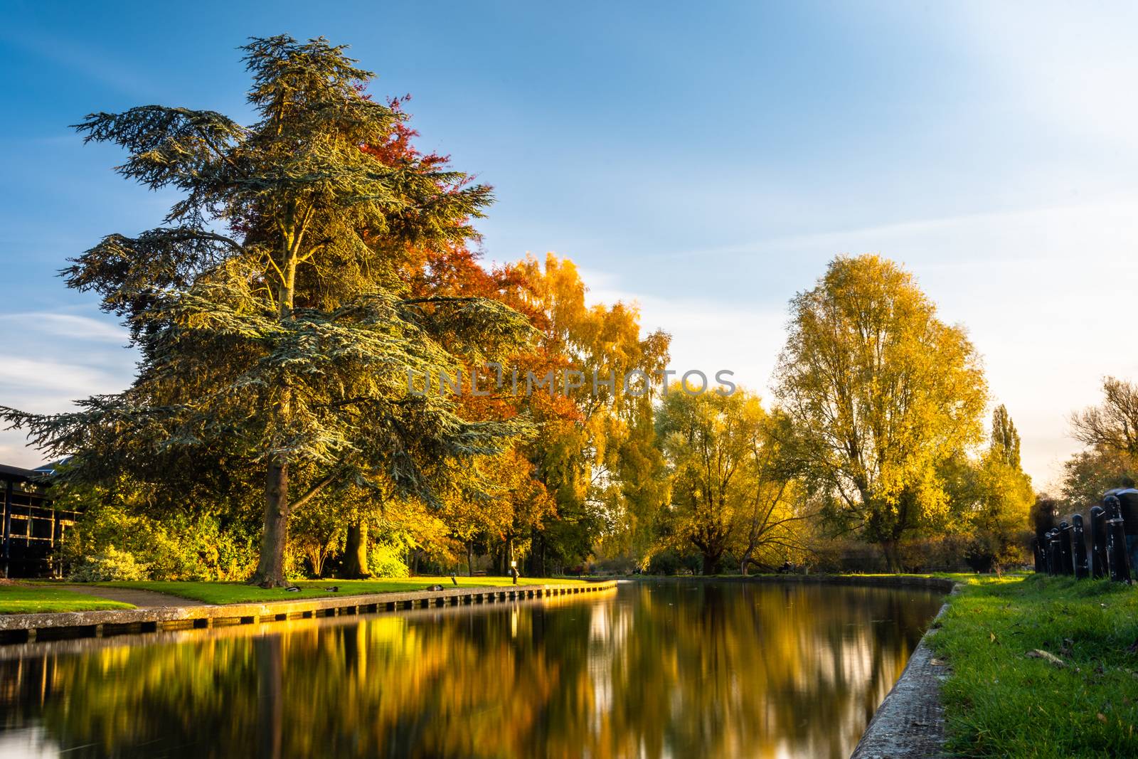 Lon exposure image of the river Cam in warm afternoon light in autumn, Cambridge